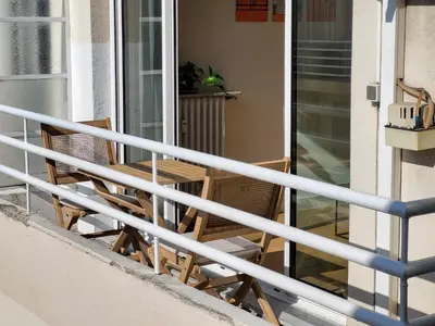 two chairs sitting on the balcony of a house at #TheCosyStudio06 Meyerbeer Promenade Negresco in Nice