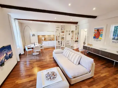 a living room with a couch and a table at 