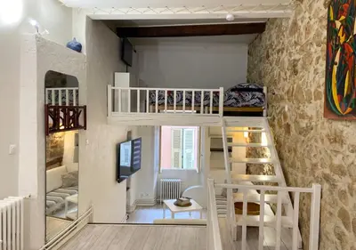 a room with a bunk bed and a staircase at Logement Atypique in Villefranche-sur-Mer