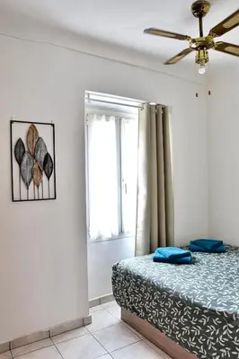a bedroom with a bed and a window at Bel appartement au cœur de Nice (2 chambres) in Nice