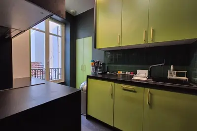 a kitchen with lime green cabinets and a window at Close to the beach behind the famous Negresco ! in Nice
