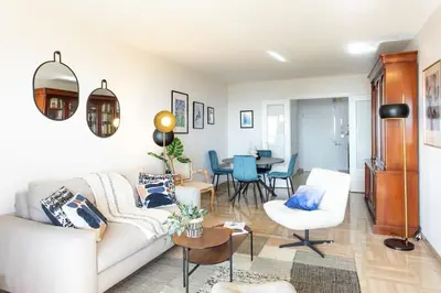 a living room with a couch and a table at L11 Claire Fontaine Sea view 2 BDR AC Parking swiming pool in Nice