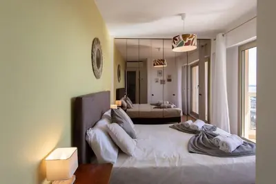 a bedroom with a large white bed in a room at L11 Claire Fontaine Sea view 2 BDR AC Parking swiming pool in Nice
