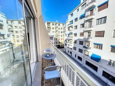 a balcony with a table and chairs in a building at Nestor&Jeeves - PALMA BEACH - Proche Mer in Nice