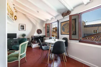 a living room with a table and chairs at Charming Apartment Old Town in Nice