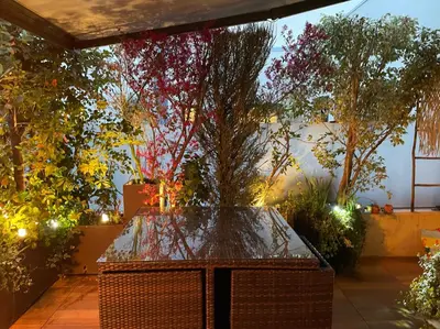 a large tree in a room with lights at Exceptional Terrace in Center of Nice in Nice