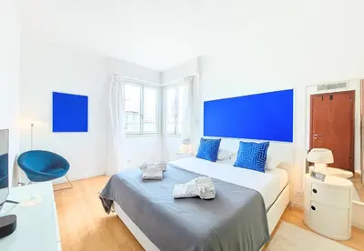 a bedroom with a bed and a blue headboard at Nestor&Jeeves - LA MAREE BLEUE - TERRACE - NEAR BEACH in Nice