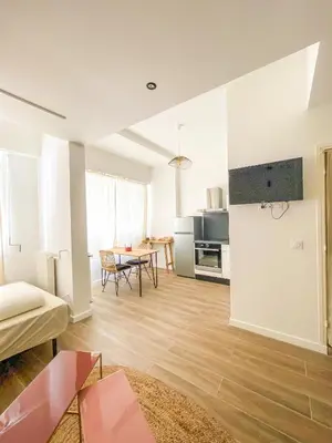 a living room with a couch and a table at Alsace Lorraine - Wifi, 3 pers, hyper centre in Nice