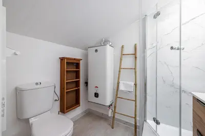 a bathroom with a toilet and a shower at Quiet 1 Bdr at Nice Port in Nice