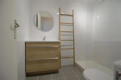 a bathroom with a sink and a mirror and a toilet at SIRIUS - Exceptionnelle vue mer dans les hauteurs de Nice in Nice