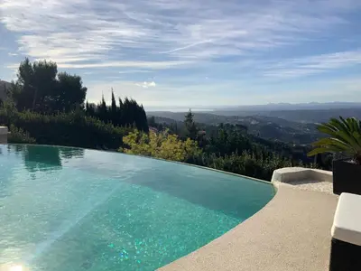 a swimming pool with a view of the mountains at Maison charmante à Aspremont avec piscine privative in Aspremont