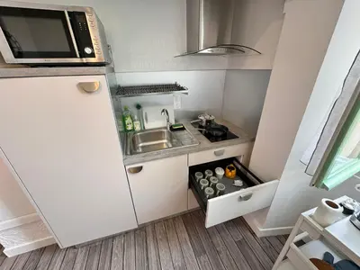 a small kitchen with a sink and a microwave at Carre D'or: Very Central Calm Cozy 2BR, with Wi-Fi in Nice