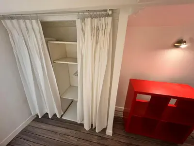 a closet with a white curtain and a red box at Carre D'or: Very Central Calm Cozy 2BR, with Wi-Fi in Nice