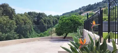 a balcony with a view of a mountain at 2p bas de Villa avec Jacuzzi privatif proche de Nice in Saint-Laurent-du-Var