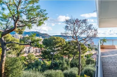 a view of a city from a balcony with trees at Nice Absea Belles Terres in Nice