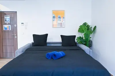 a blue towel sitting on top of a bed at Beau studio cozy centre ville et plages n13 in Nice