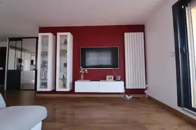 a bedroom with a large bed with a large window at Superbe appartement toit Terasse vue mer in Saint-Laurent-du-Var