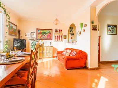 a living room with a table and a couch at Apartment L'Île de Beauté by Interhome in Nice