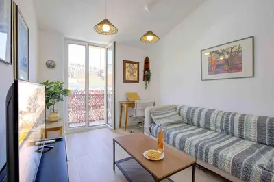 a living room with a couch and a table at Maison Bianchi - 27 Lepante in Nice