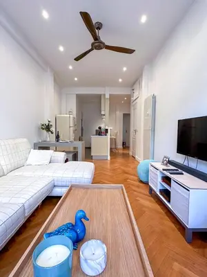 a living room with a couch and a blue toy duck on a table at Les Terrasses D'Herold in Nice