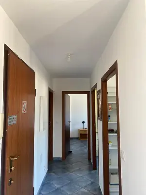 an empty hallway with two doors and a room at APPARTEMENT-NICE 01 VUE MER - PANORAMIQUE WIFI-Parking in Nice