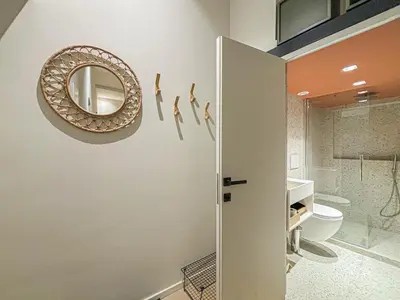 a bathroom with a shower and a mirror and a toilet at Old Town - 4 pers, AC in Nice
