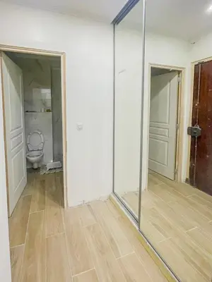 a room with a toilet and a glass wall at Gare Du Sud - Wifi, AC, balcon in Nice