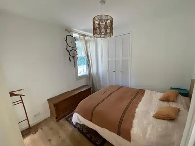 a bedroom with a bed and a window at Magnifique maison de pecheur face à la mer in Cagnes-sur-Mer