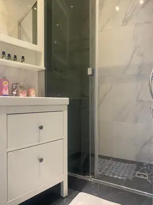 a bathroom with a white dresser and a shower at Mirela's Private Room with key, AC, lift & balcony in the center of Nice on the Cote d'Azur in Nice