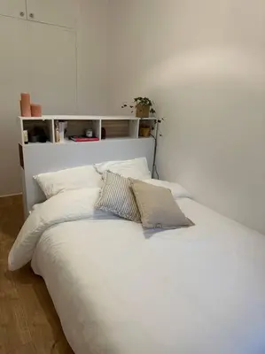 a white bed with white sheets and pillows at Cosy Nice appartement in Nice
