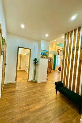 a living room with a couch and a wooden floor at Central Riviera Charm in Nice