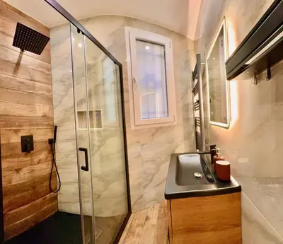 a bathroom with a sink and a shower at Central Riviera Charm in Nice