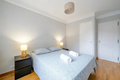 a bedroom with a bed with two pillows on it at Appartement en plein coeur de Cagnes sur Mer in Cagnes-sur-Mer