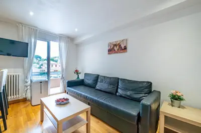 a living room with a couch and a table at Appartement en plein coeur de Cagnes sur Mer in Cagnes-sur-Mer