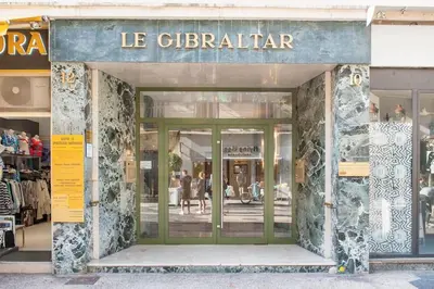 a store front of a store with green doors at 50 meters from the beach ! Best location in Nice in Nice