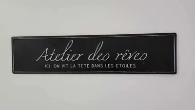 a black sign with the words after die rerio at Appartement Cosy Centre Nice in Nice