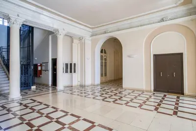 a large room with a lobby with a checkered floor at 4 stars Palais Hermitage, 5 pers, AC, Full confort in Nice