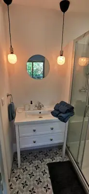 a bathroom with a sink and a shower at 2 pièces au calme avec terrasse et climatisation in Nice