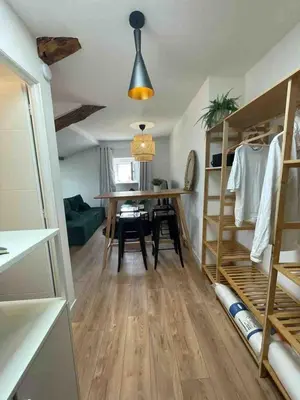 a room with a table and a dining room at Beautiful refurbished cozy apartment in Nice