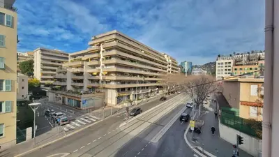 a view of a city street with a tall building at Beautiful 3 room apartment - Parking -Centre -Tram in Nice