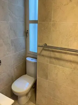 a bathroom with a toilet and a window at Massena : Hyper Centre Studio 2p in Nice