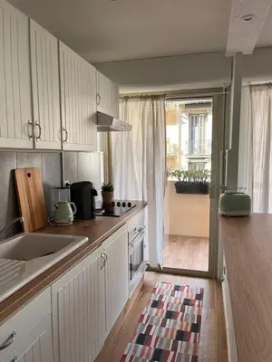 a kitchen with a sink and a counter top at Beautiful studio - Terrace in Nice
