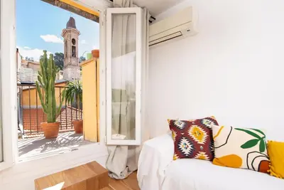 a living room with a white couch and a window at #30 Old Town, Castle panoramic View / Terrace & AC in Nice