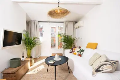 a living room with a white couch and a table at #30 Old Town, Castle panoramic View / Terrace & AC in Nice