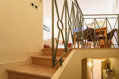 a set of stairs with a pair of scissors at LA CASA AP4409 By Riviera Holiday Homes in Villefranche-sur-Mer