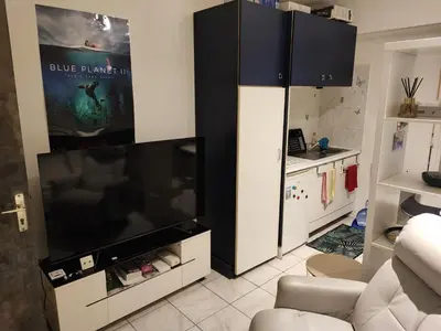 a living room with a large flat screen tv at Beau studio meublé hyper centre Nice in Nice