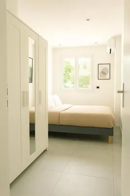 a bedroom with two beds and a window at 1 bedroom Brand new flat in the heart of Nice quartier des Musiciens in Nice