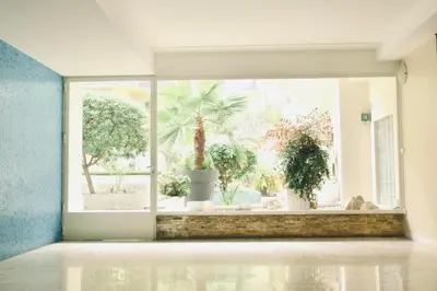 an empty room with a large window with plants outside at 1 bedroom Brand new flat in the heart of Nice quartier des Musiciens in Nice