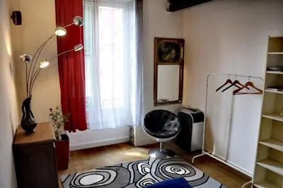 a living room with a refrigerator and a window at Nice - Stylish apartment downtown in Nice