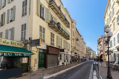 an empty street in a city with buildings at 3 pièces au cœur du carré d'or in Nice